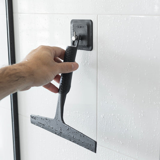 Nuvelo Telescoping Shower Squeegee in use on shower glass